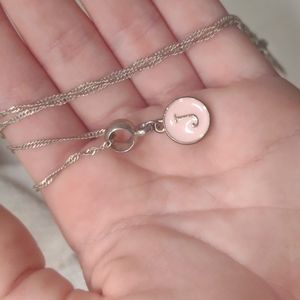 Silver necklace. Pink charm with a silver J.